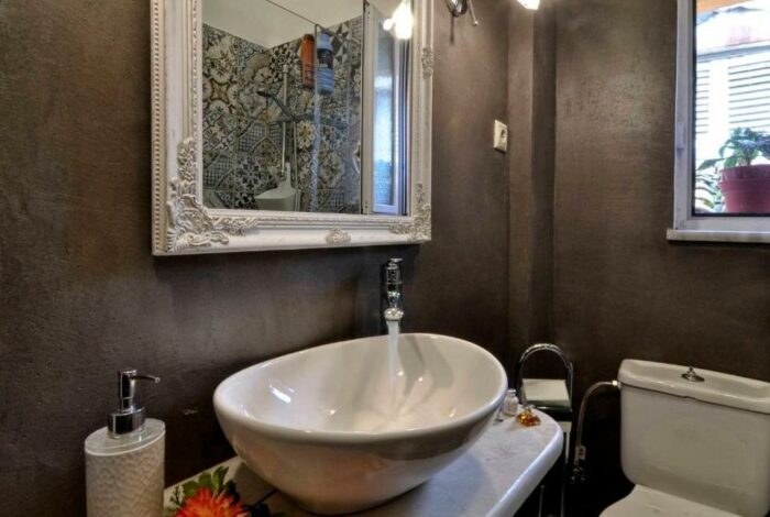 Clean, stylish bathroom with window lighting, Corfu apartment for sale