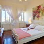 Spacious master bedroom with large window in Corfu Town apartment