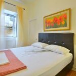 Cozy guest bedroom in renovated Corfu apartment for sale