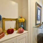 Elegant hallway with traditional flooring and soft lighting in restored Corfu apartment near Liston Square