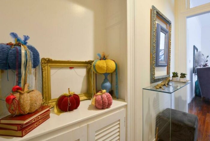 Elegant hallway with traditional flooring and soft lighting in restored Corfu apartment near Liston Square