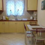 Open-plan kitchen with dining area in first-floor apartment Kanalia Corfu