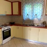 Functional kitchen space integrated with living area, ideal for everyday living in Corfu