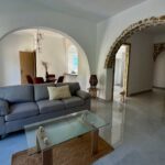 Open plan living and dining area with natural light in Aspiotades Corfu apartment