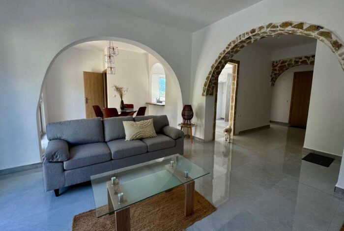 Open plan living and dining area with natural light in Aspiotades Corfu apartment