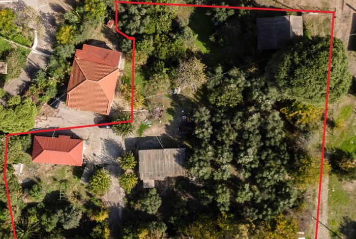 Drone view of Zacharo coastline showcasing 3,216sqm beachfront plot for sale