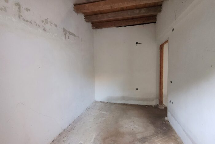 Spacious raw bedroom layout in Kastania property needing finishing works