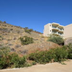 Holiday complex surrounded by mountains and coastal scenery