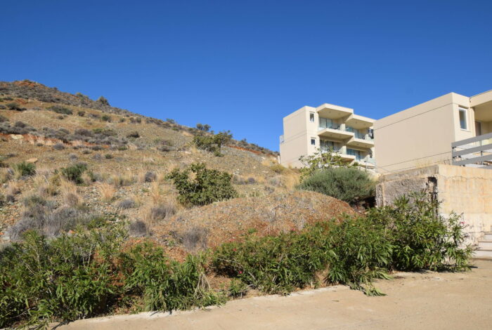 Holiday complex surrounded by mountains and coastal scenery