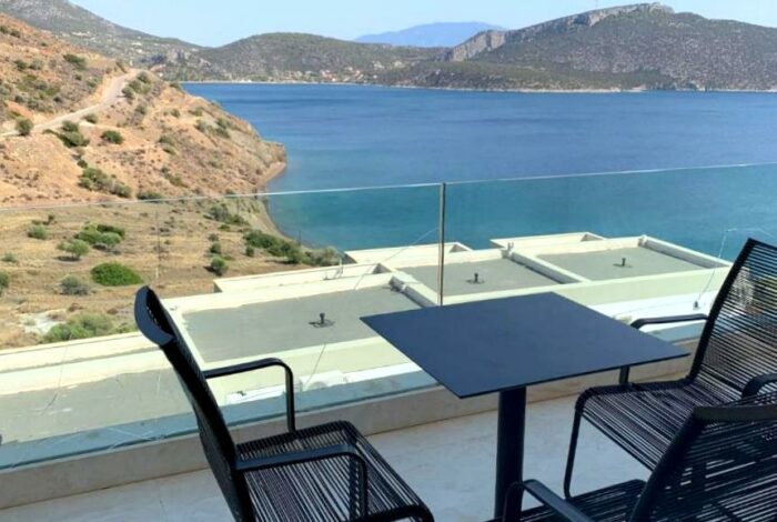 Private balcony with sitting area and unobstructed sea views