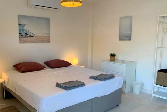 Double bed bedroom with modern fittings in coastal apartment