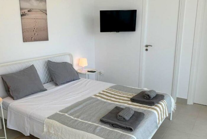 Cozy bedroom in maisonette with views toward Corinthian Bay