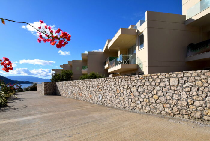 Alyki Boeotia apartment complex with sea views and stone architecture