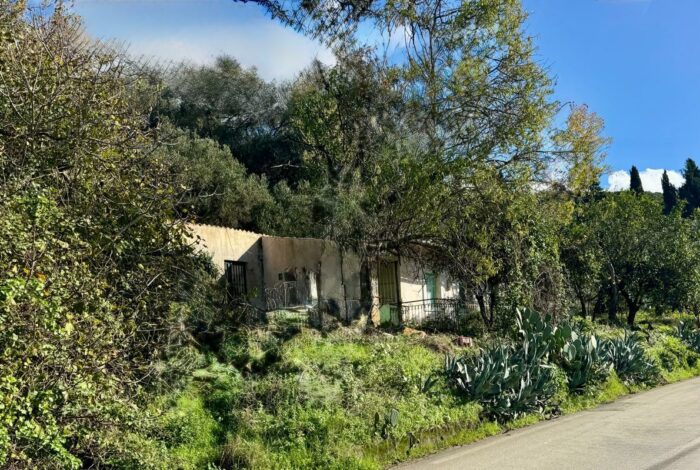 North-West Corfu real estate plot with existing small house and building rights