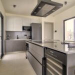 Fully equipped kitchen with high-end appliances and dining space