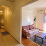 Living room with open layout and balcony access in Garitsa Corfu property
