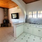 Open plan living room and kitchen area in detached house Perivoli Corfu