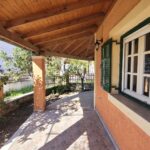 Covered terrace surrounding the detached house in Perivoli