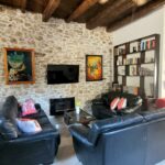 Living area with fireplace traditional Corfiot house renovated interior