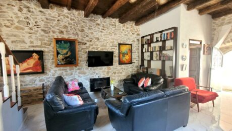 Living area with fireplace traditional Corfiot house renovated interior