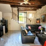 Open plan living room kitchen stone house Corfu modern interior