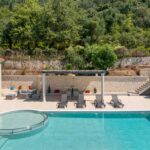 Private villa exterior with swimming pool and terraces in Agios Markos Corfu