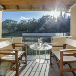 Balcony view overlooking green countryside