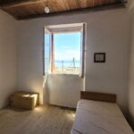 Spacious bedroom layout with natural light in Corfu village home