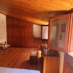 Spacious bedroom with wooden floors in historic apartment in Corfu Old Town