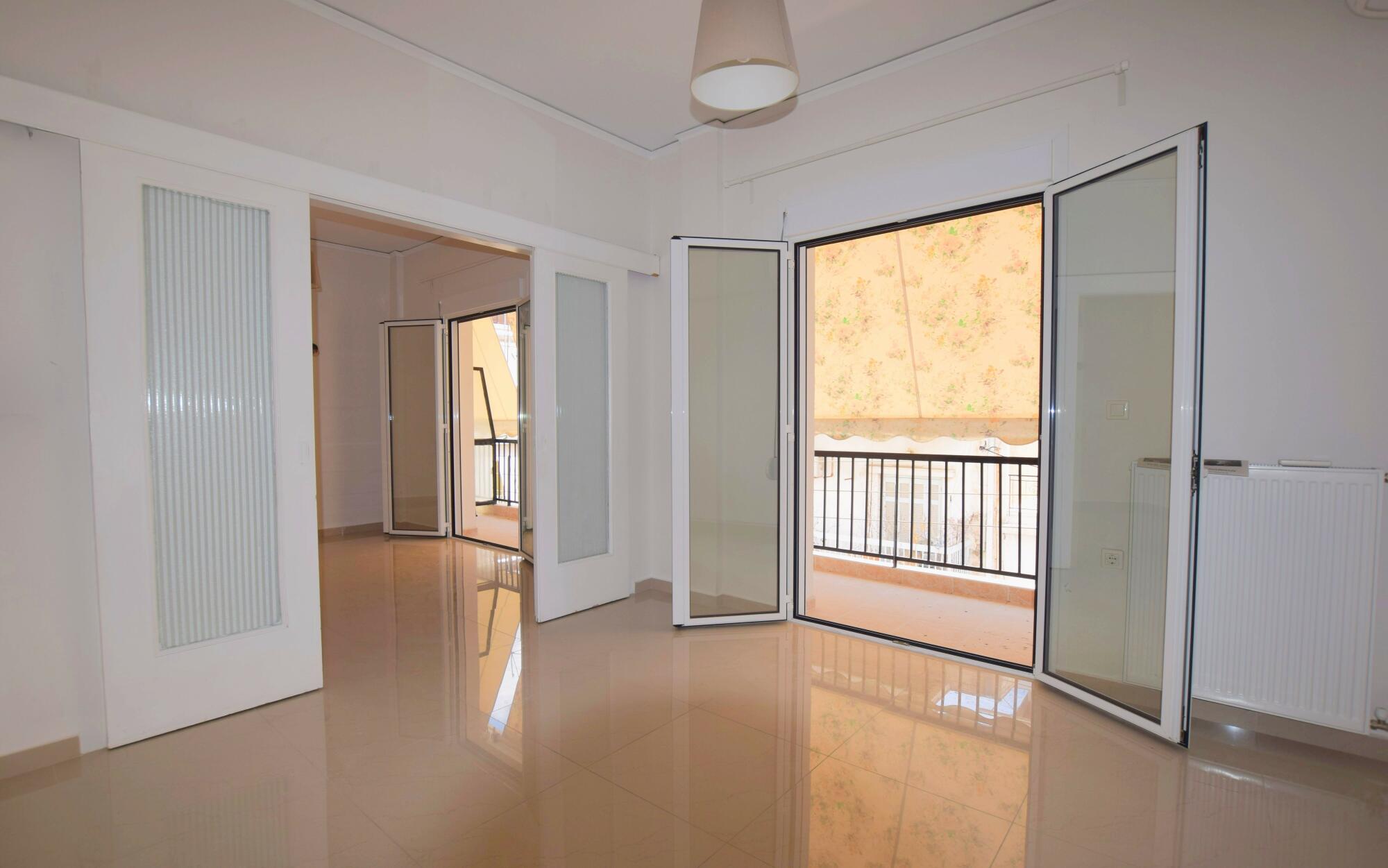 Renovated apartment living room in Tambouria Piraeus with bright natural light