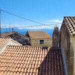 Balcony with sea views from bedroom in Chlomos South Corfu property