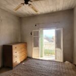 First floor bedrooms in Corfu village house with natural light and renovation potential