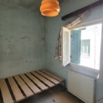 First floor bedroom with windows and views to the village