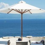 Sun loungers beside the swimming pool with panoramic coastal views