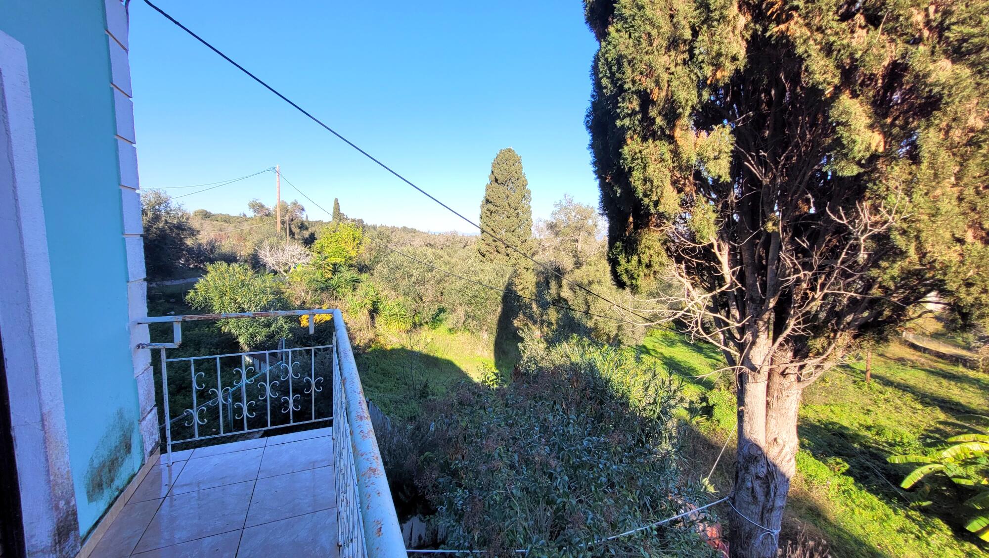 Two floor apartment complex that needs renovation in Kavos, South Corfu
