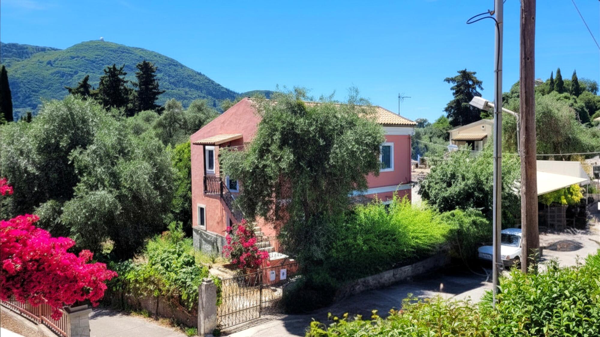 Traditional two-storey house for sale in Gastouri Corfu with spacious garden and courtyard