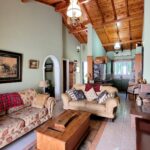 Open plan living room with fireplace in Corfu home
