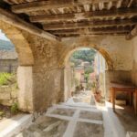 Historic stone house in Nymfes North Corfu featuring Venetian arches