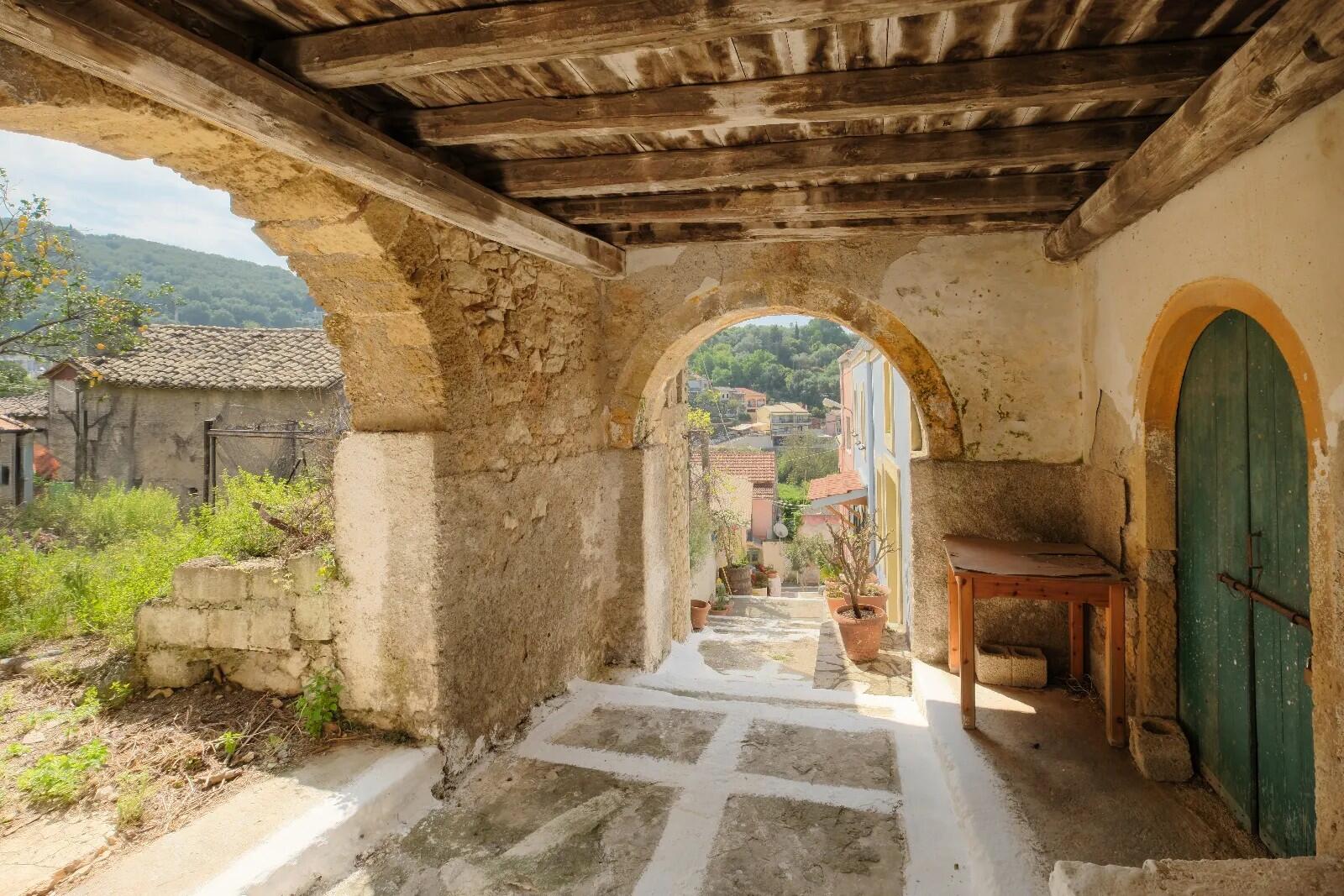 Historic stone house in Nymfes North Corfu featuring Venetian arches