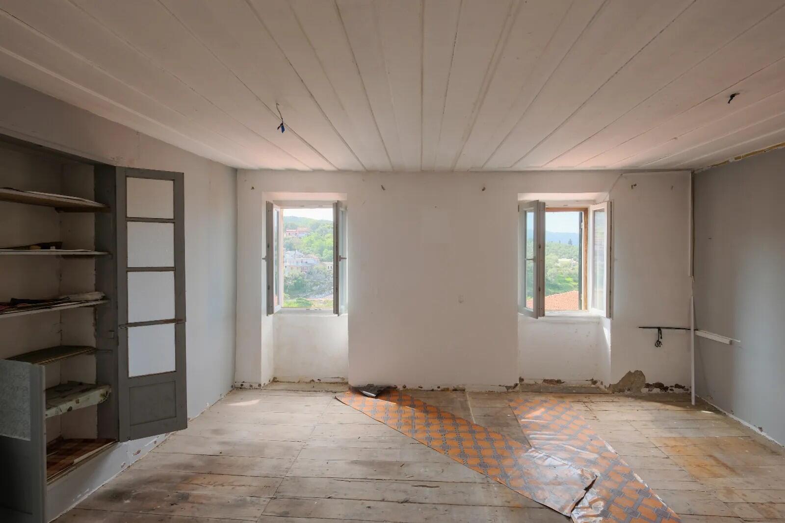 Spacious living area inside traditional Venetian house in Corfu