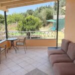 Covered outdoor seating area at villa in Avliotes Corfu
