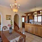 Open plan living room kitchen and dining area in Corfu house