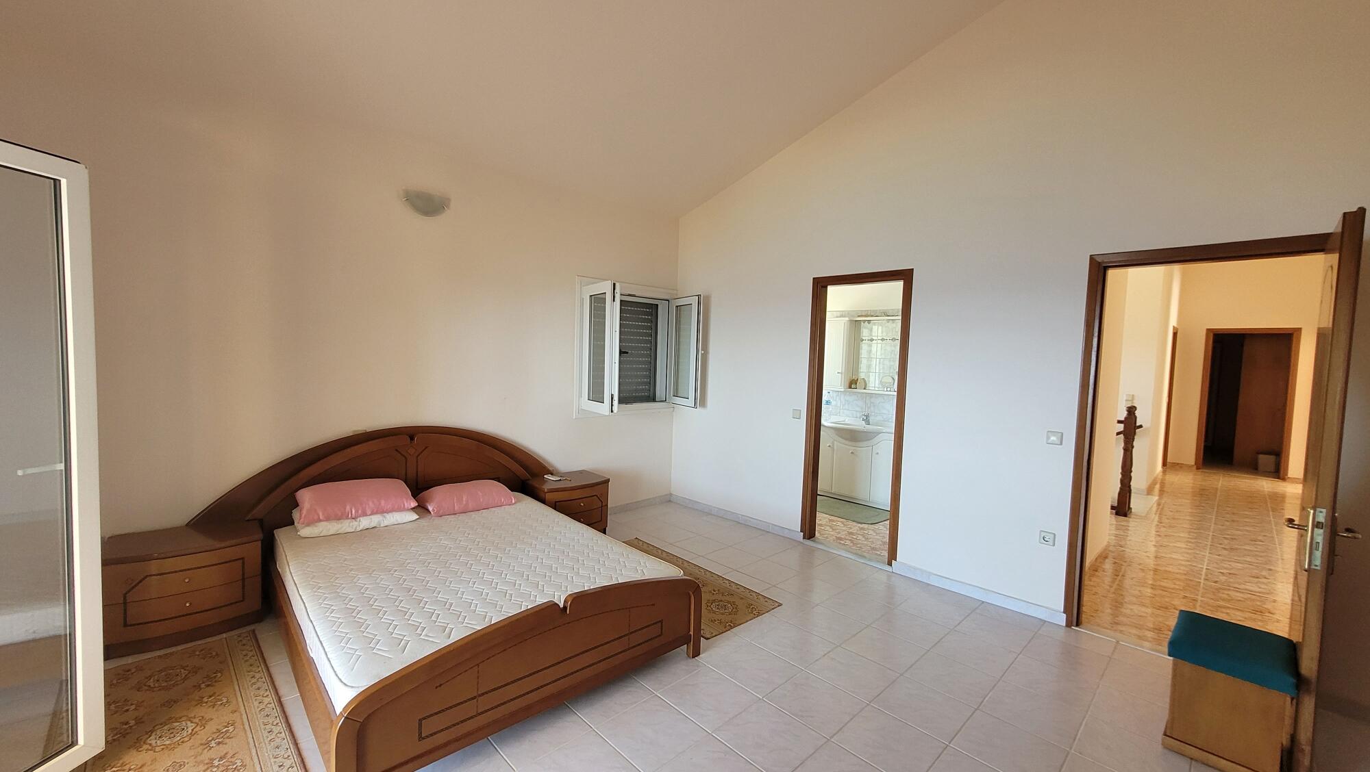 Spacious bedroom with en-suite bathroom in luxury Corfu villa