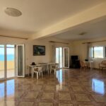 Bright open-plan living room with sea views