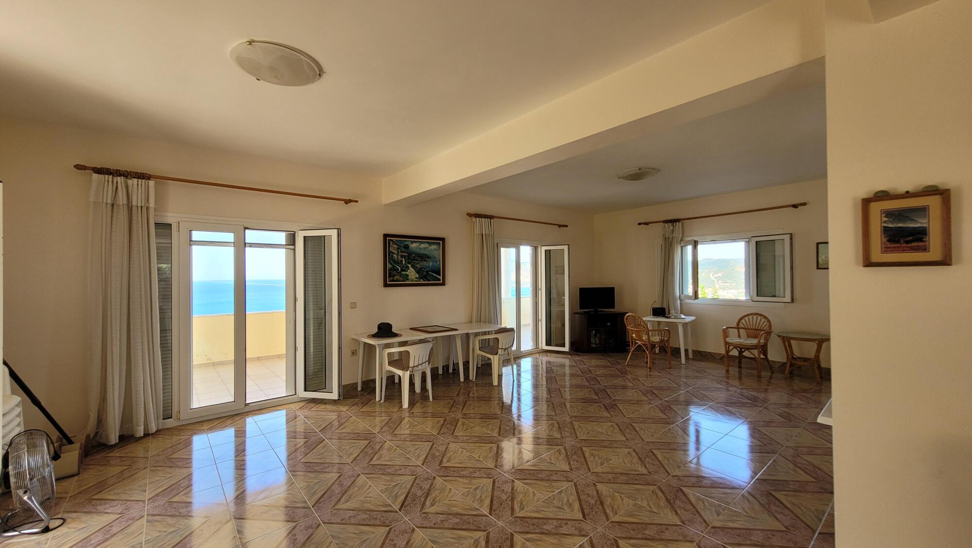 Bright open-plan living room with sea views
