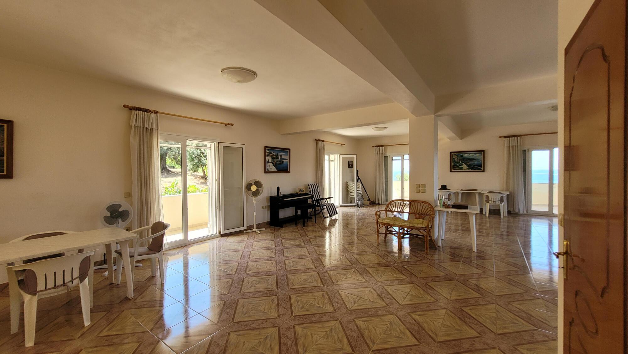 Open plan lounge-kitchen-diner in Agios Georgios villa