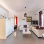 Open-plan living room and kitchen in a house for sale in Corfu