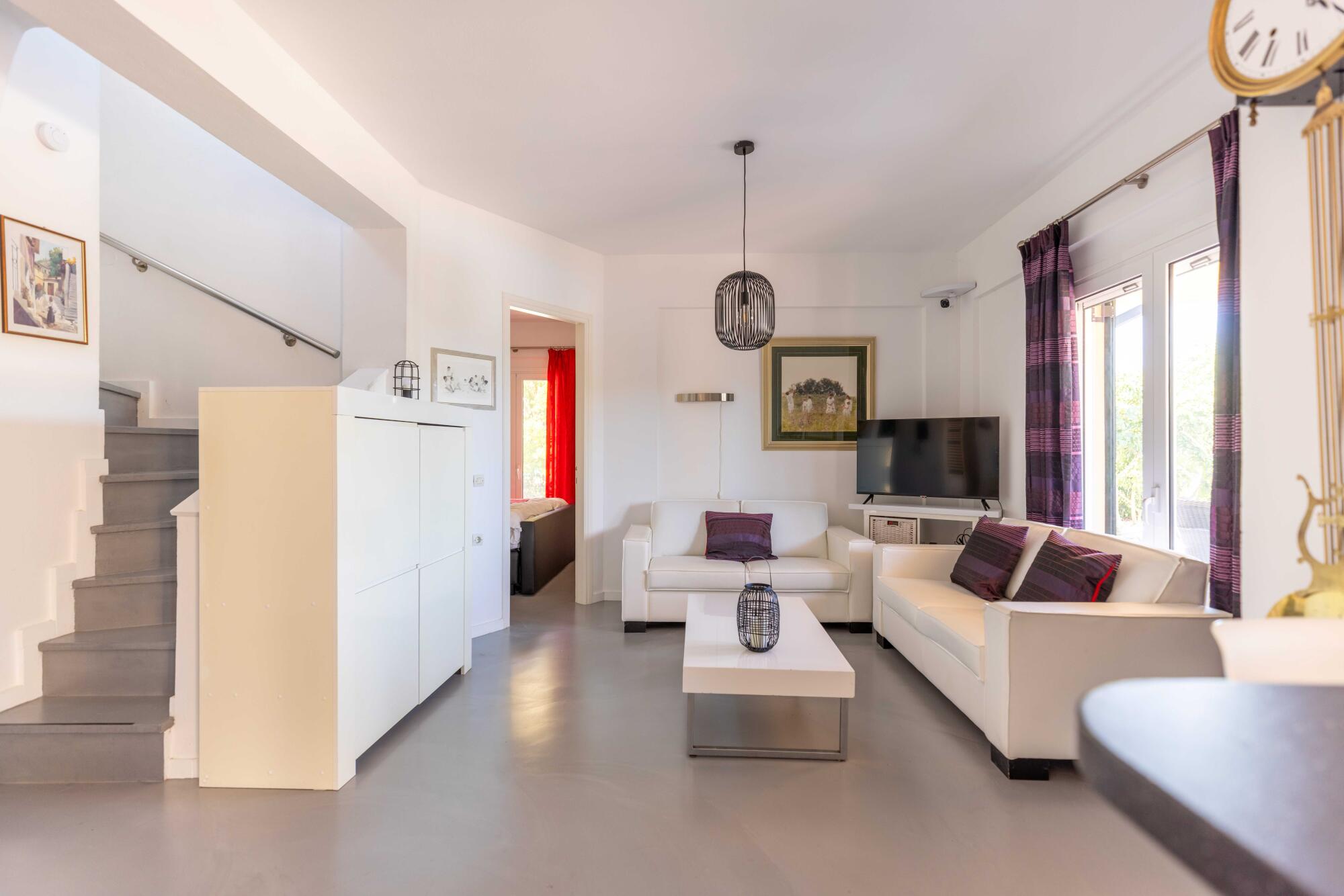 Open-plan living room and kitchen in a house for sale in Corfu