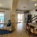 Living room with access to the swimming pool area