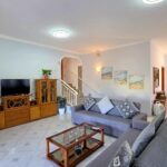 Spacious living room with dining area in Lefkimmi residence
